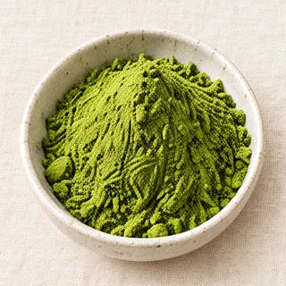 A bowl of green matcha powder